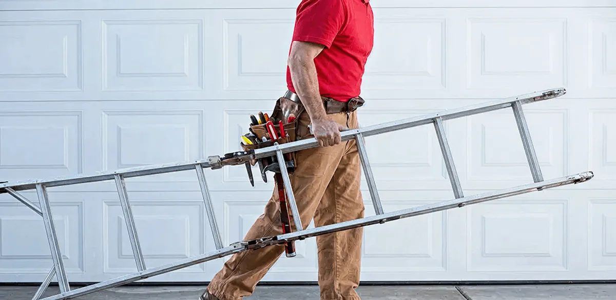 Garage door repair technician arriving with tools and ladder in Myrtle Beach, SC