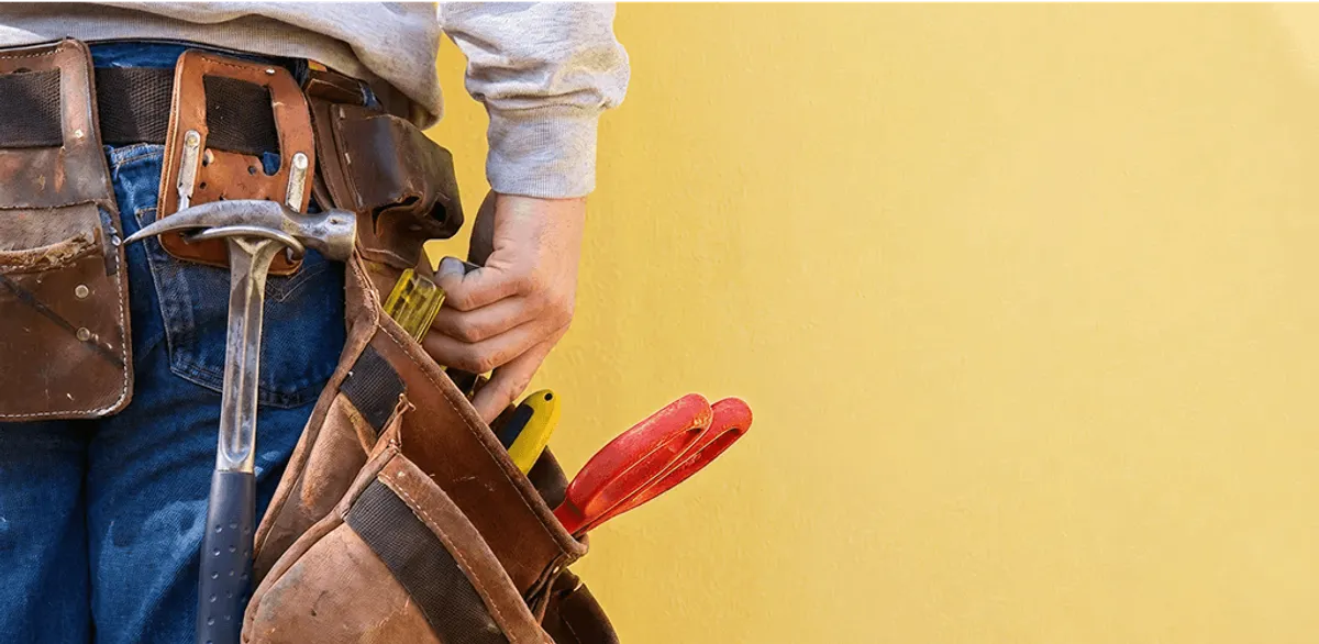 Handyman with tool belt ready for home repairs and maintenance in Myrtle Beach, SC